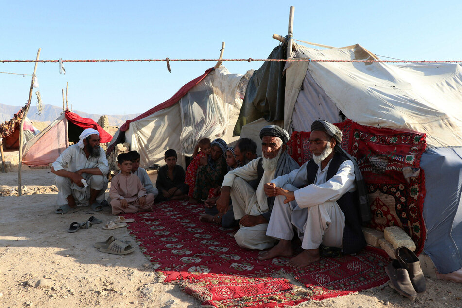 Afghan citizens are seen at a displaced persons camp in Mazar-i-Sharif as fighting has intensified since the start of US troop withdrawal.