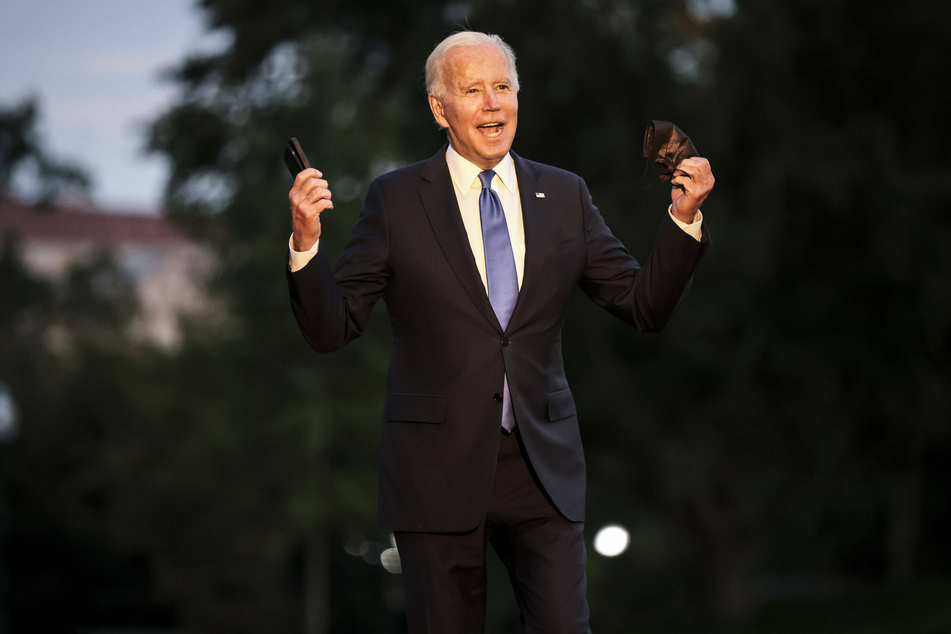 Biden speaking to reporters on the South Lawn of the White House after returning from his trip to Connecticut.