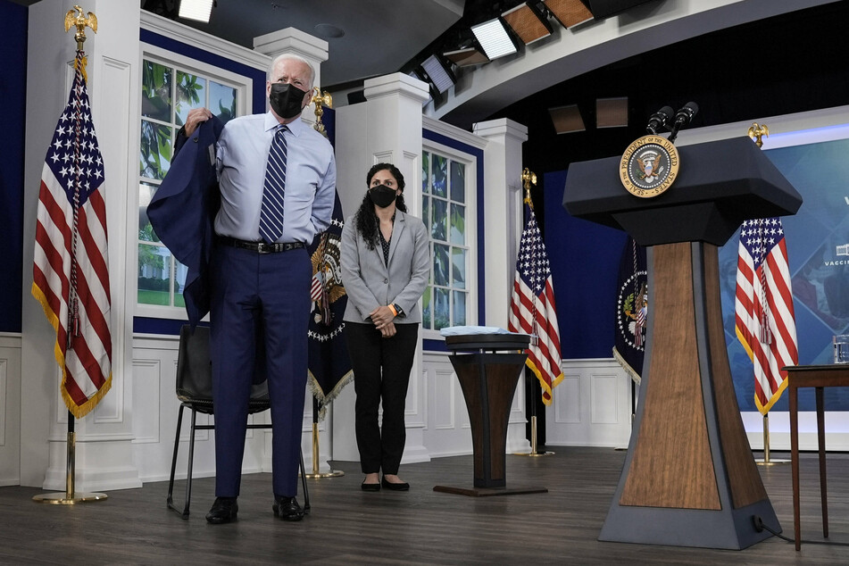 Experts have urged Biden to focus on vaccinating people around the world.