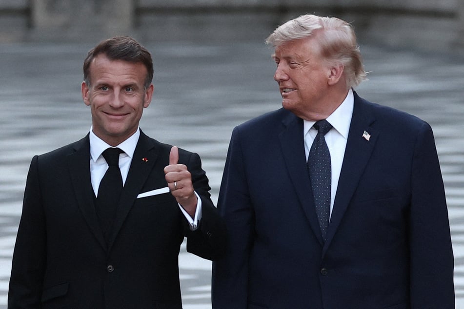 France's President Emmanuel Macron (l.) welcomes President Donald Trump (r.) at Chateau de Versailles on June 17, 2026.