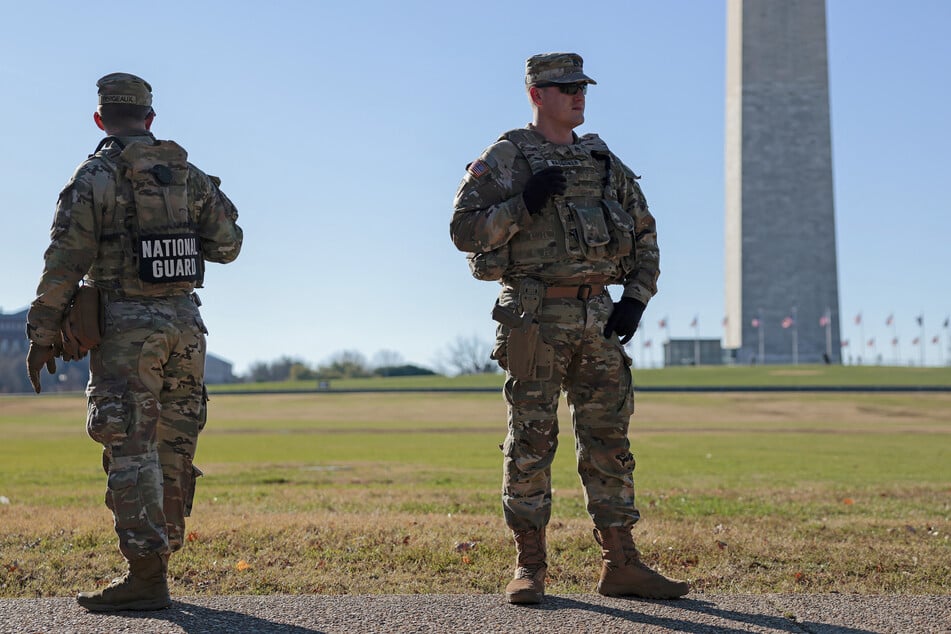 Members of the National Guard patrol along Constitution Ave. in Washington DC on December 1, 2025.
