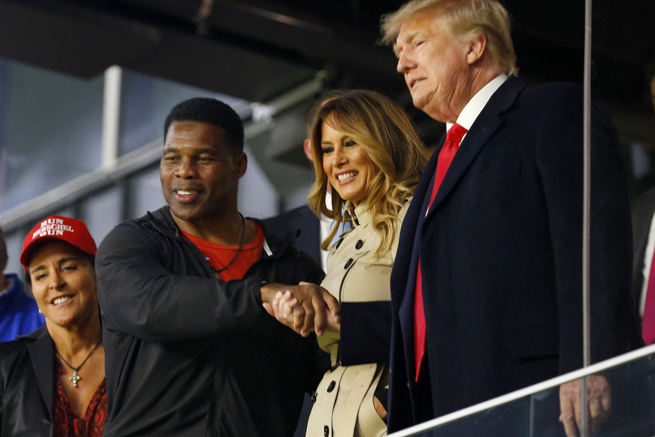Herschel Walker shaking hands with former president Donald Trump.