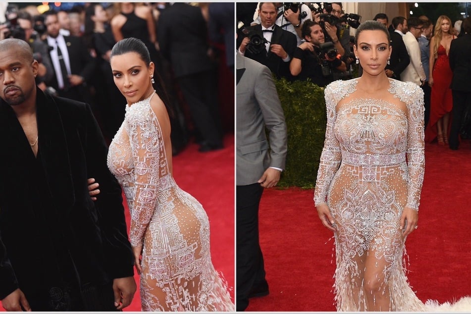 Kim Kardashian (r) wore a breathtaking Roberto Cavalli gown at the Met Gala in 2015, complete with crystals and feathered detailing. She walked the red carpet with Kanye West (l.)