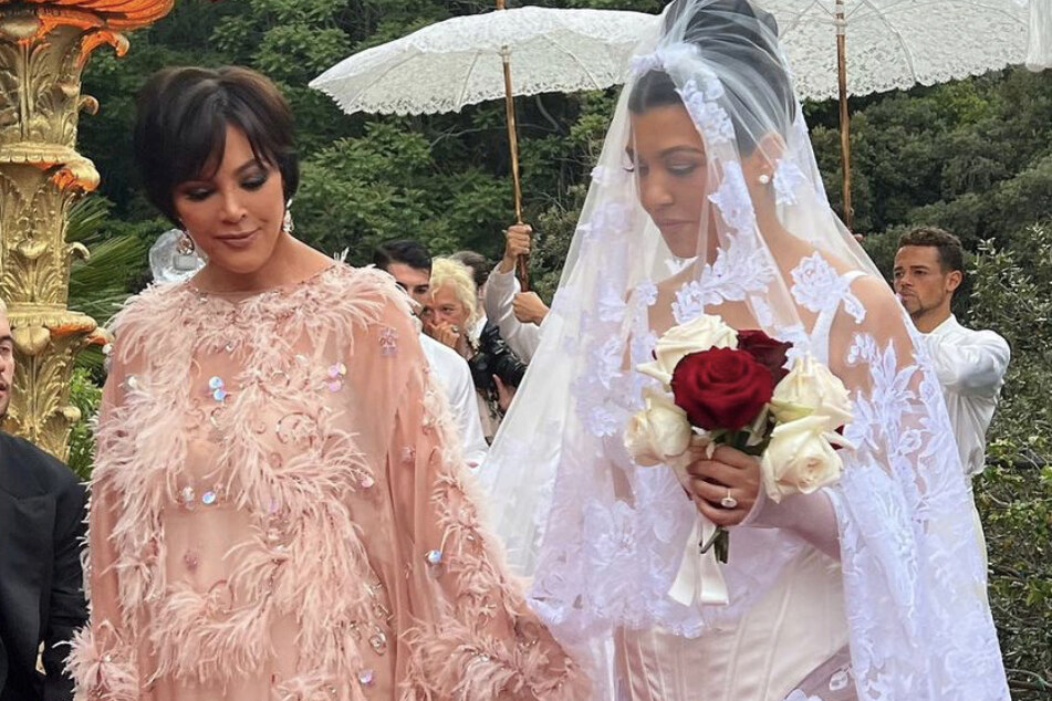 Kourtney is lovingly given away by her mother Kris Jenner (l) during her third wedding to Travis.
