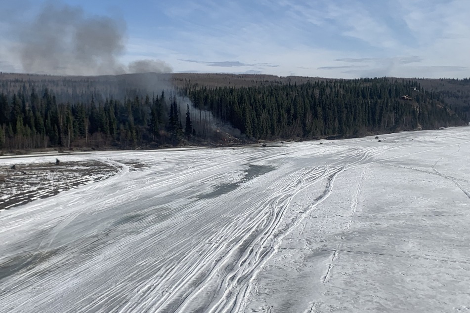 A photo shared by the State of Alaska Department of Public Safety shows the crash site of a rare World War II-era cargo plane outside Fairbanks.