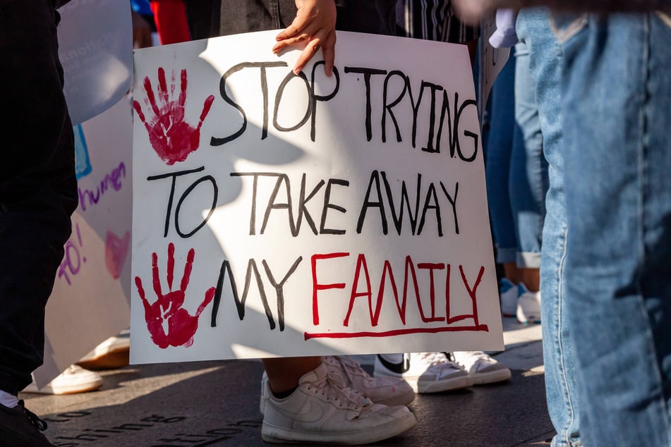 TPS holders, their children, and their allies rally for protections against family separations in Washington DC.
