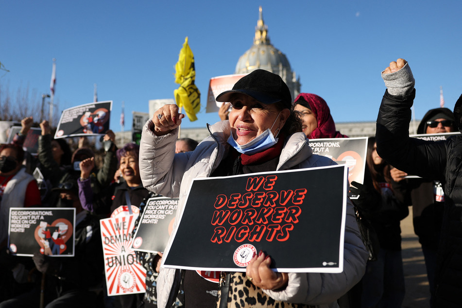 California Gig Workers Union members rally against Proposition 22, which granted app-based transportation and delivery companies the ability to classify their drivers as independent contractors, in San Francisco on December 13, 2022.