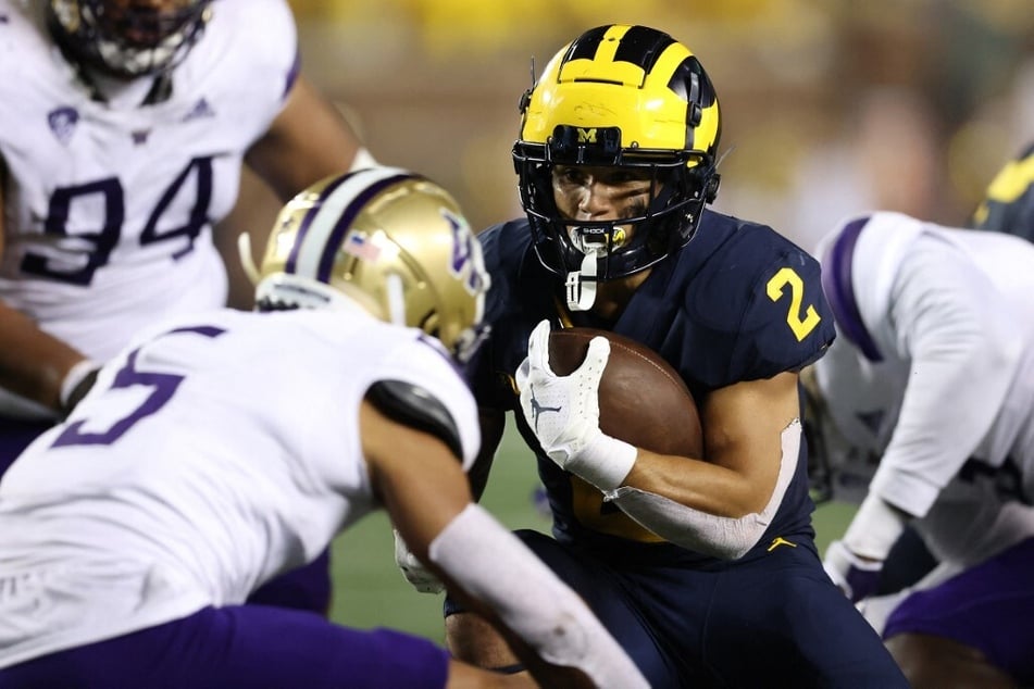 The College Football Playoff National Championship will be played by Michigan and Washington.
