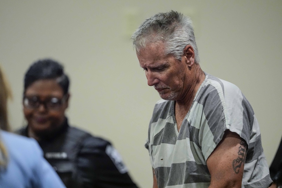 POOL / GETTY IMAGES NORTH AMERICA / GETTY IMAGES VIA AFP Photo by POOL / GETTY IMAGES NORTH AMERICA / GETTY IMAGES VIA AFP WINDER, GEORGIA - SEPTEMBER 6: Colin Gray, 54, the father of Apalachee High School shooting suspect Colt Gray, 14, enters the Barrow County courthouse for his first appearance, on September 6, 2024, in Winder, Georgia.