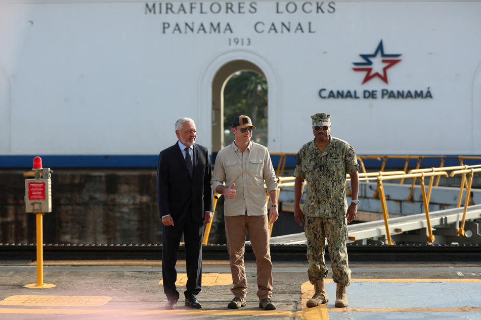 US Secretary of Defense Pete Hegseth, Panama Canal Authority Administrator Ricaurte Vasquez, and Commander of the US Southern Command Adm. Alvin Holsey pose during a tour of the Miraflores locks in Panama City on April 8, 2025.