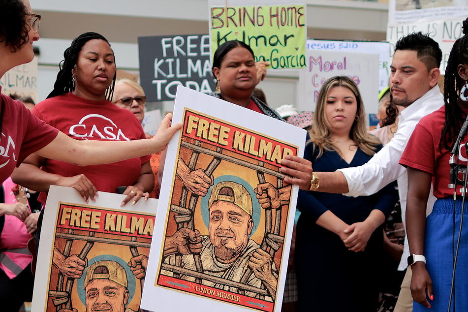 Jennifer Vasquez Sura (2nd R), the wife of Kilmar Abrego Garcia, is joined by supporters, advocates from CASA de Maryland, fellow union members, and others as they rally in front of the US District Court for Maryland ahead of a hearing on his case on July 7, 2025 in Greenbelt, Maryland.