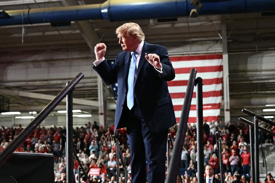 President Donald Trump dances as he walks off stage at a midterm campaign rally at Crossroads Arena in Corinth, Mississippi on October 26. Trump has been hosting near-daily rallies as the GOP faces intense pressure in the races.