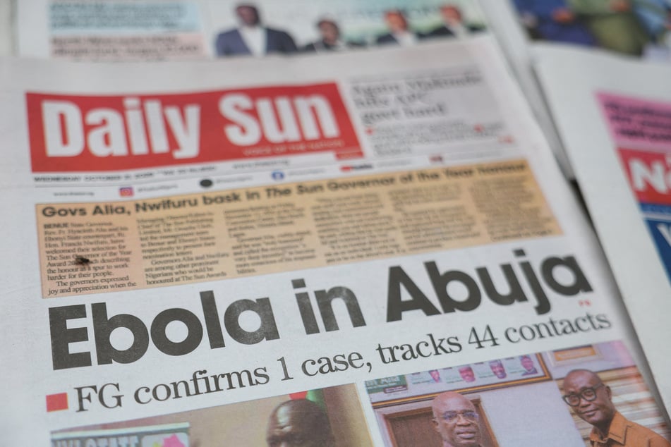 A newspaper's front page carrying a headline about a reported Ebola case in Nigeria's capital, Abuja, is displayed at a newspaper stall in Lagos on October 21, 2026.