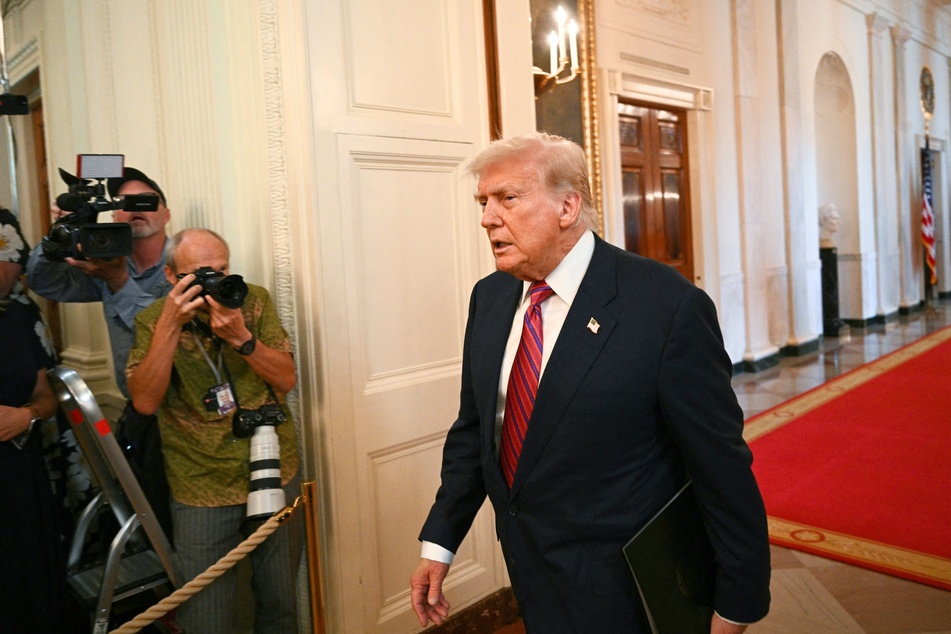 Recent reports found that Donald Trump's (pictured, r.)name was included in a list of contributors to a book celebrating the 50th birthday of Jeffrey Epstein in 2003.