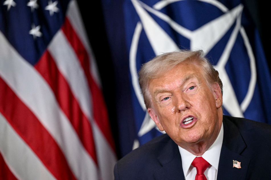 President Donald Trump said US membership of NATO was "beyond reconsideration" in his strongest hint yet that he aims to quit the alliance.