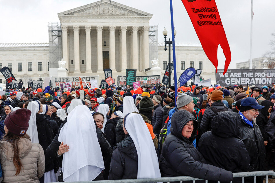 Anti-abortion protesters march for more restrictions on reproductive rights