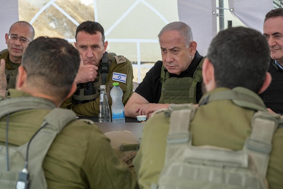 Israel's Prime Minister Benjamin Netanyahu, Defense Minister Israel Katz, and army Chief-of-Staff Herzi Halevi are pictured during a briefing in the Netzarim Corridor on November 19, 2024.