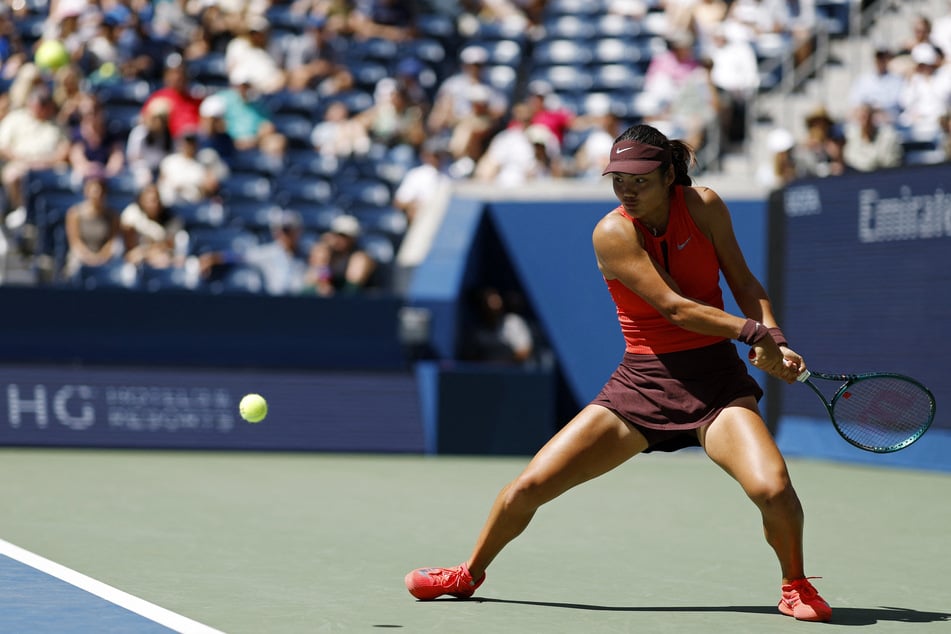 Emma Raducanu of Britain hits a backhand against Janice Tjen of Indonesia on day four of the US Open.