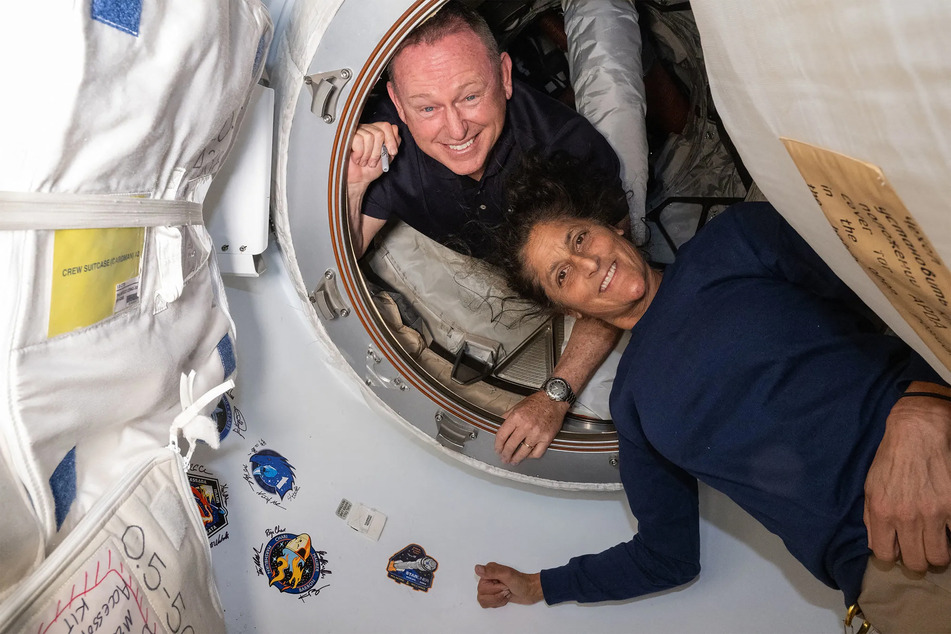 NASA astronaut Butch Wilmore (l.) reached out when he heard a "strange noise" in his spaceship.