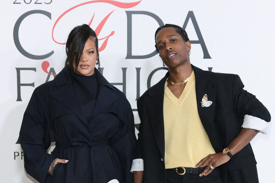 Rihanna let the world know that A$AP Rocky (r.) has the no. 1 album as Don't Be Dumb tops the charts.