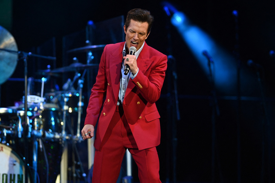 Frontman Brandon Flowers invited a Russian fan on stage during the concert in Georgia.