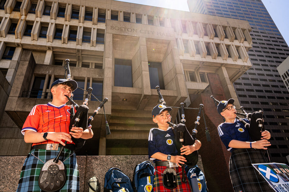 Scotland fans wear kilts and play the bagpipes outside of Boston City Hall before a FIFA World Cup watch party on Saturday.
