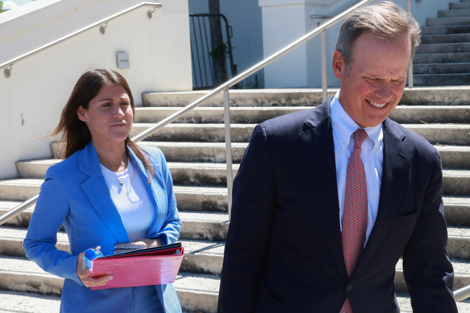 Sasha Dadan (l.), a lawyer for Walt Nauta, an aide to former President Donald Trump, and Christopher Kise, a lawyer for Trump, leave the Alto Lee Adams Sr United States Courthouse on May 22.