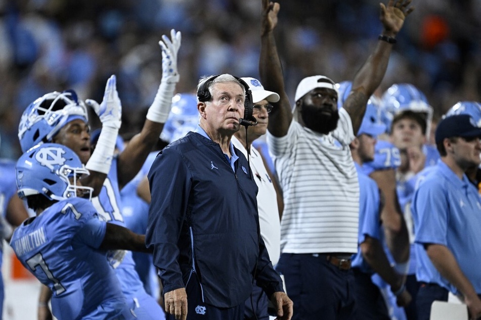 On Thursday, Tar Heels head coach Mack Brown (c.) thanked the NCAA for re-examining the eligibility situation.