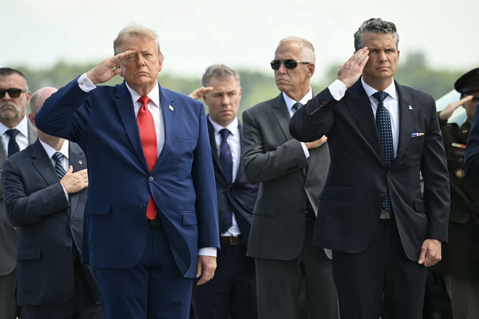 President Donald Trump (l.) and Secretary of Defense Pete Hegseth attend a dignified transfer ceremony in Delaware on July 22, 2026. The president said he expects peace talks with Iran to resume this week after saying the country "overplayed their hand."