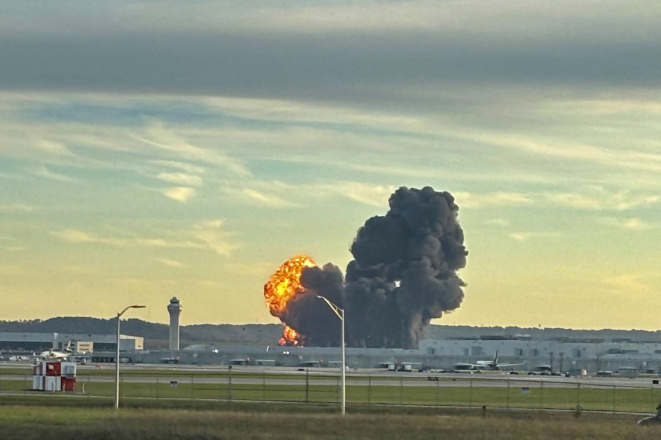 Smoke and flames rise from the site of a UPS cargo plane crash outside Louisville International Airport in Kentucky on November 4, 2025.