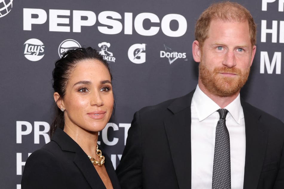 Prince Harry (r.) spoke about the dangers of sharing photos of children online as his wife Meghan Markle continues to share subtle glimpses of their own kiddos.
