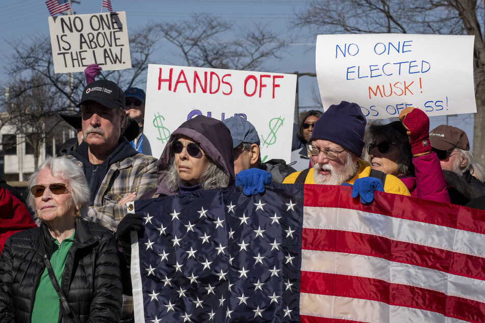 Maryland lawmakers and members of the public rally outside of the Social Security Administration headquarters in opposition to job cuts by Elon Musk's Department of Government Efficiency.