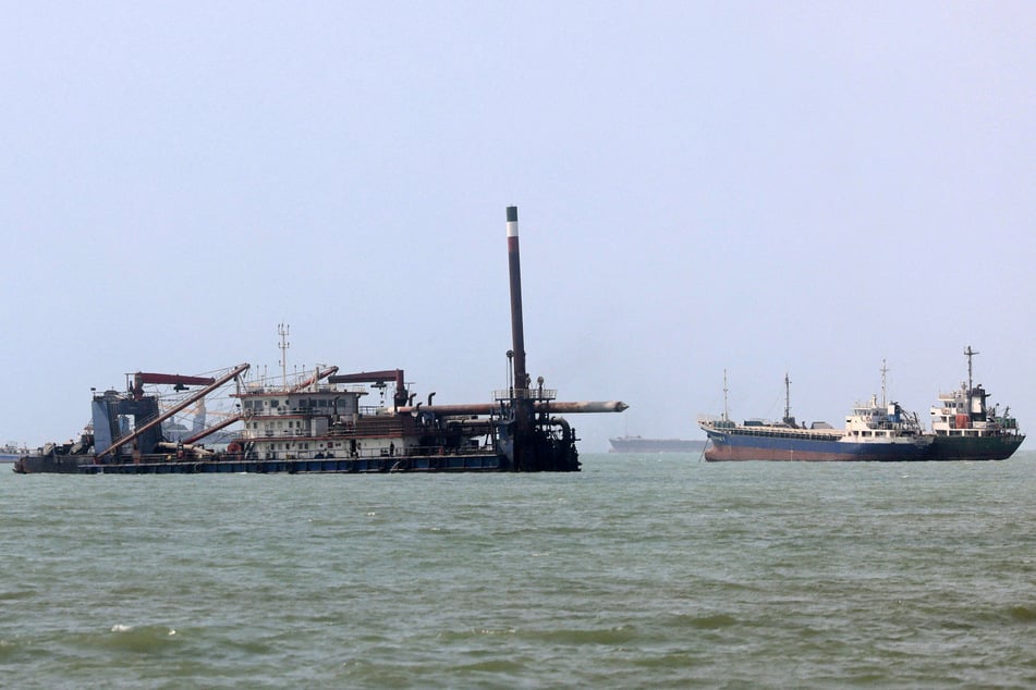Ships transit the Strait of Hormuz off Bandar Abbas in southern Iran on October 10, 2026.