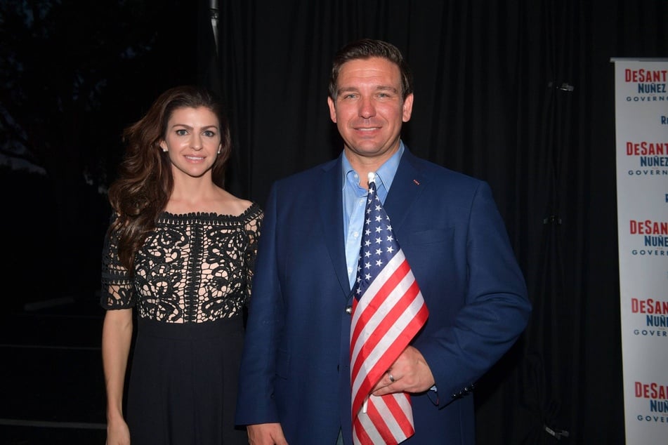 Ron DeSantis and his wife Casey DeSantis pose backstage at a rally in Boca Raton, Florida on November 4, 2018.