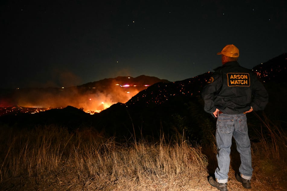 The brush fire in the mountains west of Los Angeles has prompted evacuation warnings.