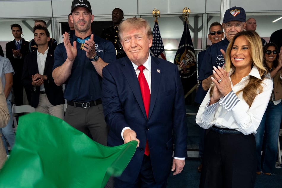 Trump takes ceremonial lap and waves green flag as he steals spotlight at Freedom 250 Grand Prix