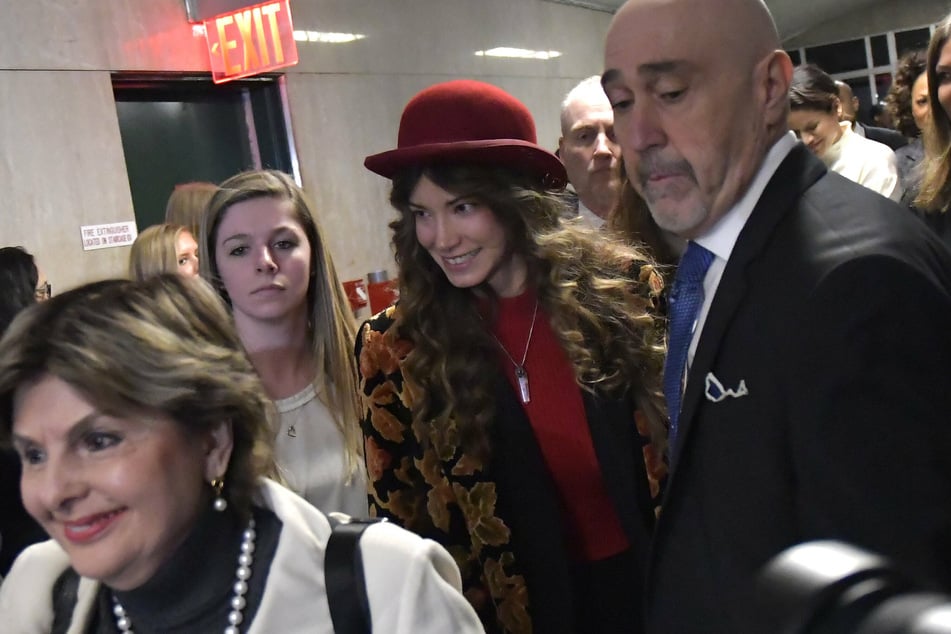 Actor and victim of Harvey Weinstein Lauren Young (c.) exits the courtroom at Manhattan in March 2020.