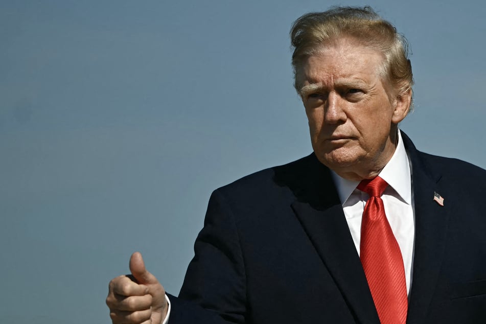 President Donald Trump gestures as he walks to board Air Force One at Joint Base Andrews, Maryland, on Tuesday. A judge has doubled down on an order to halt the president's tree-cutting plans at a DC golf course.
