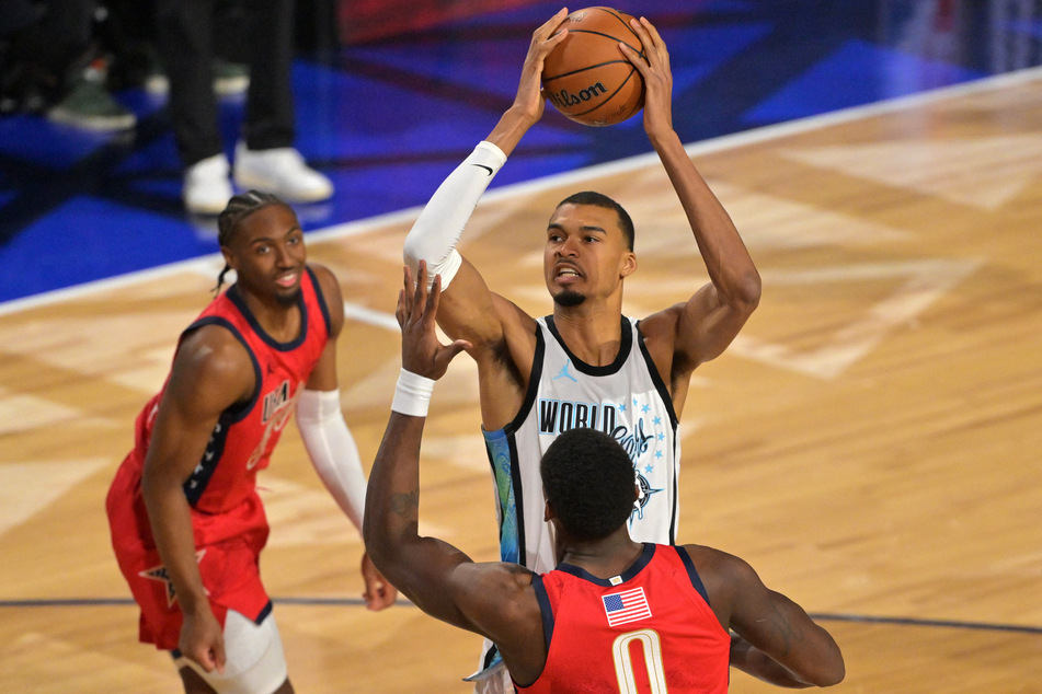 Team World center Victor Wembanyama of the San Antonio Spurs shoots against Team USA Stars center Jalen Duren of the Detroit Pistons in game one during the 75th NBA All-Star Game at Intuit Dome.