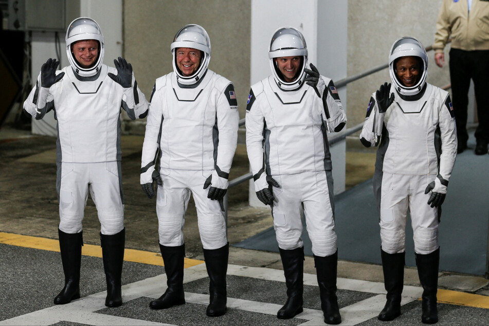 From l. to r.: Roscosmos cosmonaut Alexander Grebenkin and NASA astronauts Michael Barratt, Matthew Dominick, and Jeanette Epps depart for the launch pad before their mission to the International Space Station.