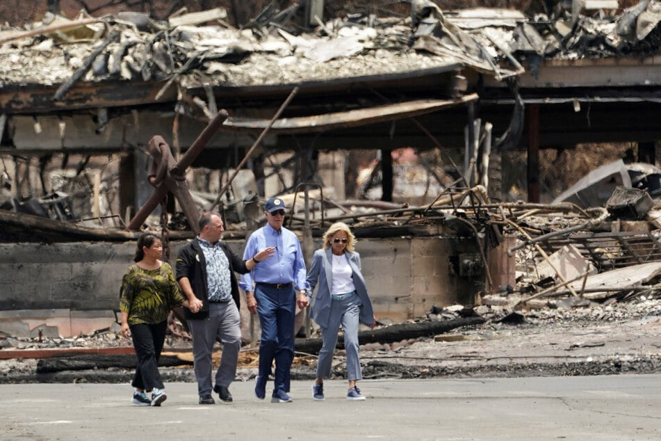 President Joe Biden and first lady Jill Biden walk with Hawaii Governor Josh Green and his wife Jaime Green to survey the damage in Lahaina.