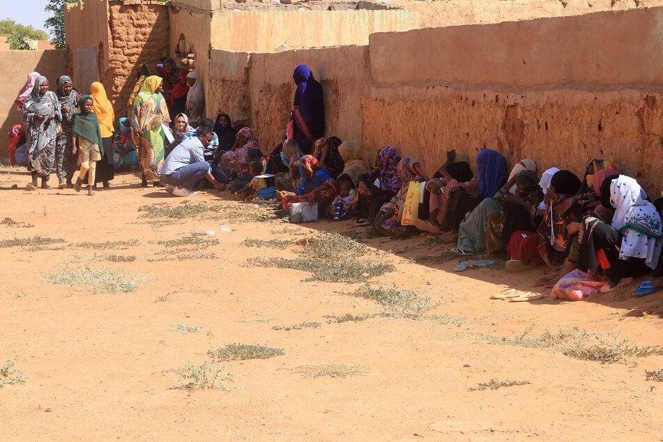 Displaced people from the towns of Bara and Umm Dam Haj Ahmed in North Kordofan State take shelter in Omdurman, part of greater Khartoum, on November 10, 2025.