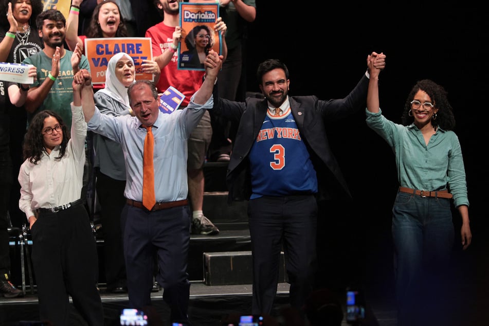 From l. to r.: Claire Valdez, Brad Lander, Zohran Mamdani, and Darializa Avila Chevalier pose together during a rally at Kings Theatre in Brooklyn on June 18, 2026.