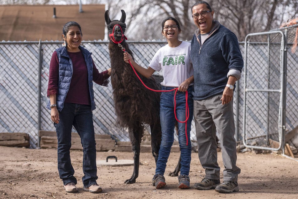 Dr. Kee Straits (l.), Sami Straits (c.), and Andrew Thomas celebrating Dalai Llama's 27th birthday in January at their home in Albuquerque, New Mexico.