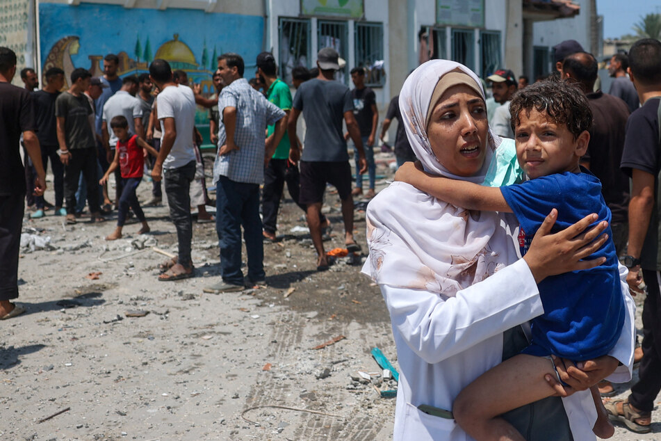 Gaza's health ministry reported "30 martyrs and more than 100 wounded" in the strike on Khadija school in the central Deir el-Balah area.