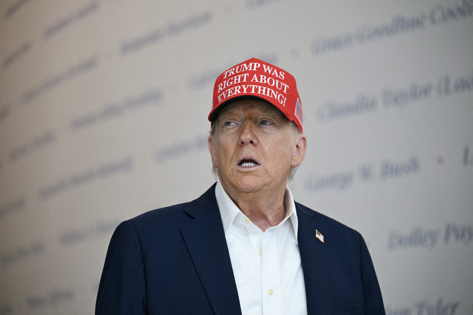 US President Donald Trump speaks at The People's House, a White House immersive experience across the street from the Eisenhower Executive Office Building, during a tour on Friday, in Washington, DC.
