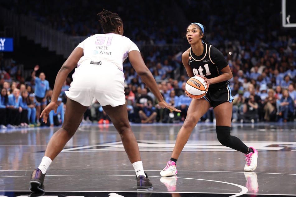 Angel Reese of the Atlanta Dream looks to shoot a three-pointer against Aminata Gueye of the Golden State Valkyries during the second quarter in game three of the WNBA Finals.