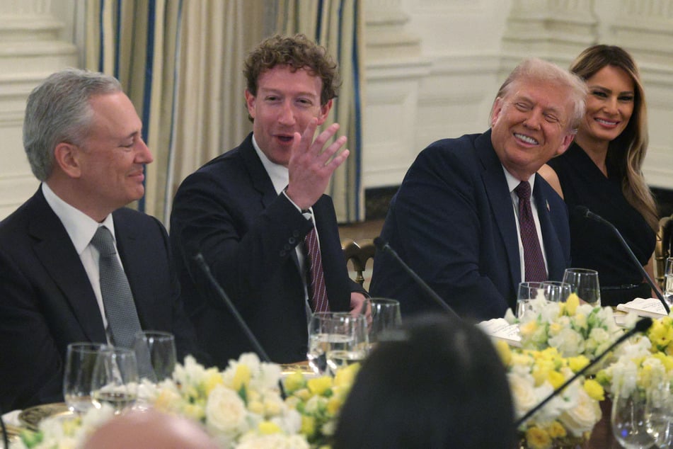 President Donald Trump (c/r) hosts a dinner alongside Meta CEO Mark Zuckerberg (c/l) in early September. He, Zuckerberg, and other AI leaders will meet at the White House on Tuesday.