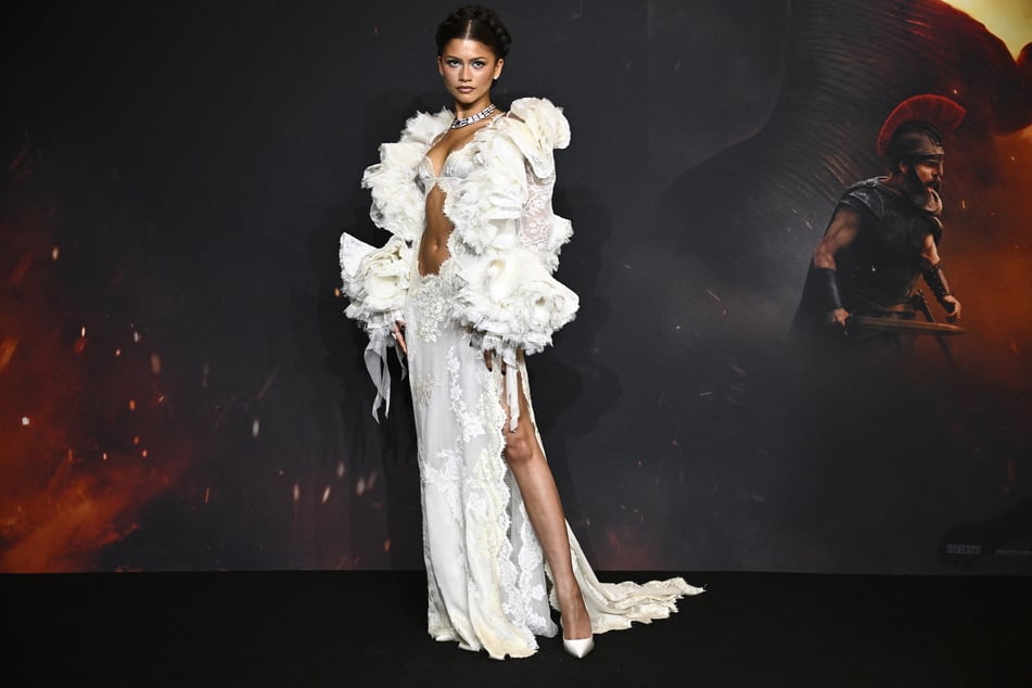 Zendaya wore a custom Louis Vuitton dress complete with ruffles and dramatic puffed sleeves at the Paris premiere.