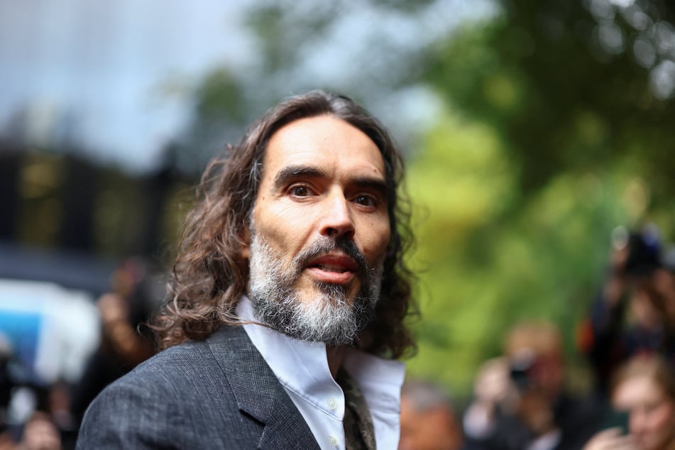 Russell Brand said nothing to members of the press as he walked into the London courthouse.